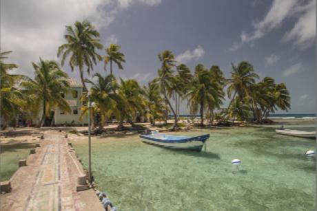 Boat docked by pier of Carrie Bow Cay