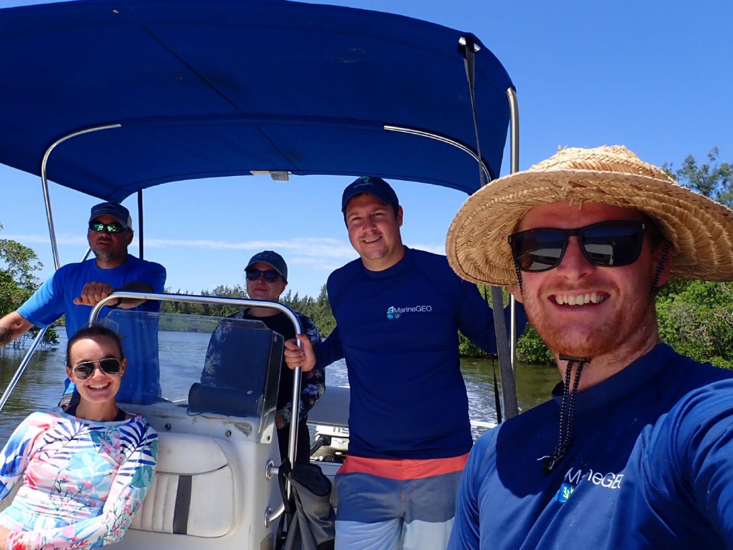 5 People on a small boat